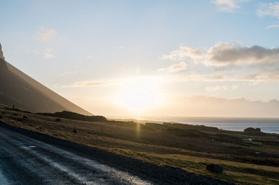 Scenic view of road against sky during sunset