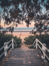 Footpath by sea against sky