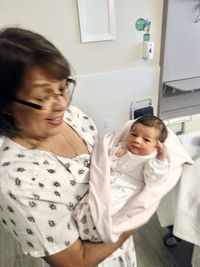 Cute girl smiling while sitting on floor