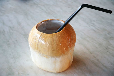 Close-up of coconut water on table