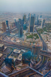 High angle view of buildings in city against sky