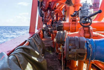 Fuel transfer coupling and connector on the portside of a tugboat while in operation at oil field