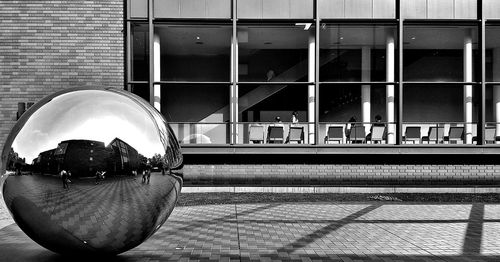 Reflection of building on glass window