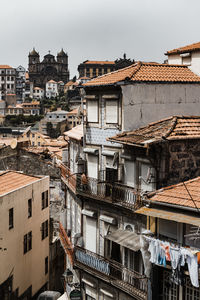 Buildings in city against sky