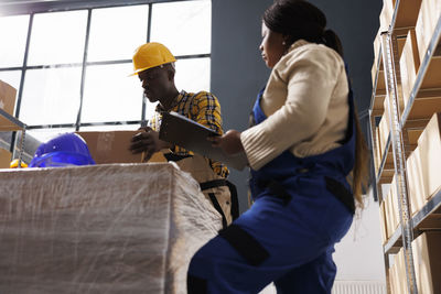 Rear view of man working at construction site