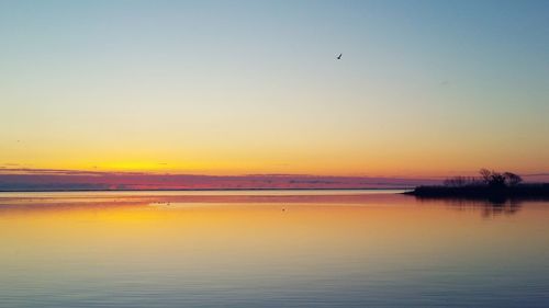 Scenic view of sea at sunset