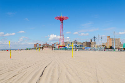 Scenic view of beach against clear blue sky