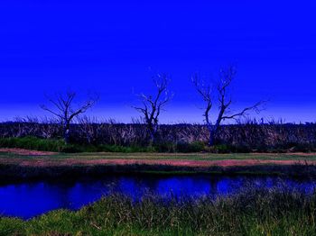 Scenic view of lake against blue sky