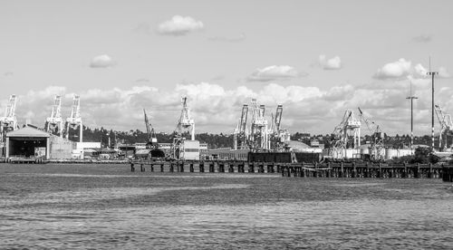 Pier at harbor against sky