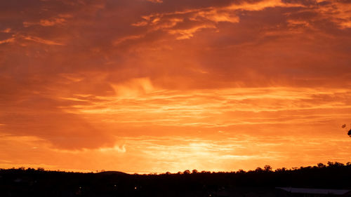 Low angle view of dramatic sky during sunset
