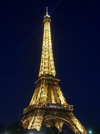 Low angle view of illuminated building against sky