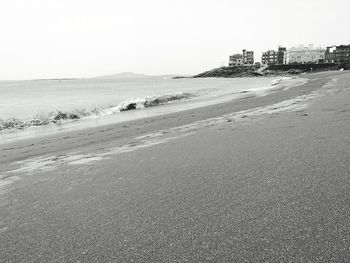 Scenic view of beach against clear sky