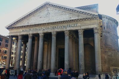 People at historical building