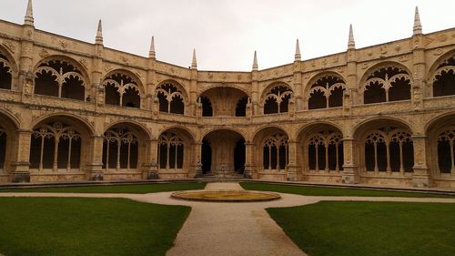 Facade of historic building against sky