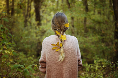 Rear view of woman with yellow umbrella