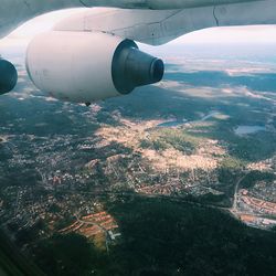 Aerial view of cityscape seen through airplane window