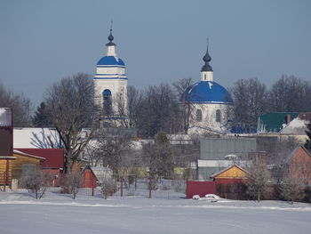 Building against sky during winter