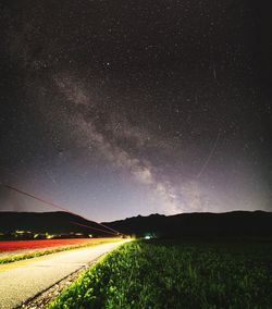 Scenic view of field against sky at night