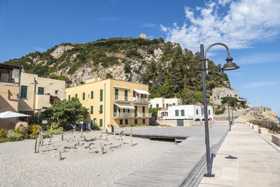 Houses and buildings against blue sky