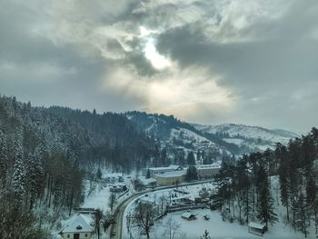 Scenic view of snow covered mountains against sky