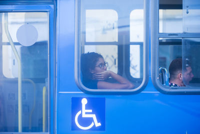 Portrait of people in glass window