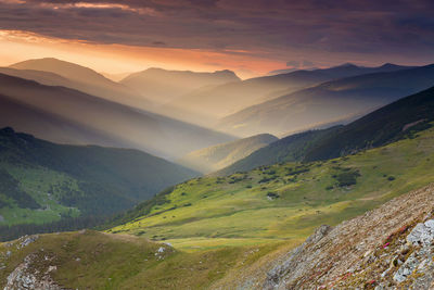 Scenic view of mountains against sky during sunset