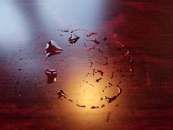 High angle view of raindrops on glass