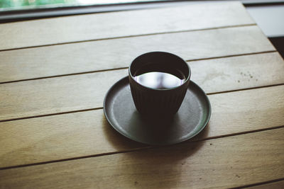 High angle view of coffee cup on table