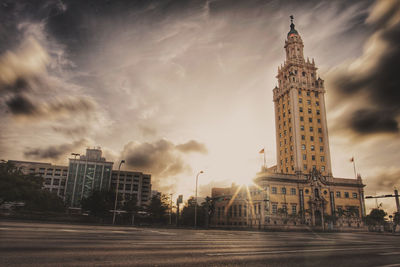 City street against cloudy sky