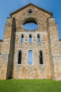 Low angle view of old building against clear sky