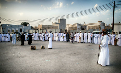 Group of people in row against temple