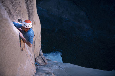 Rock climber crack climbing on the nose, el capitan in yosemite