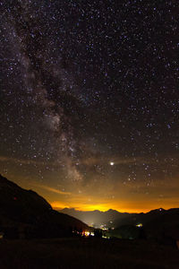 Scenic view of star field against sky at night