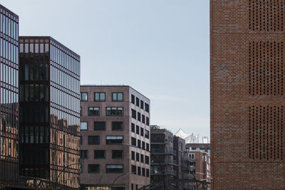 Low angle view of modern buildings against sky