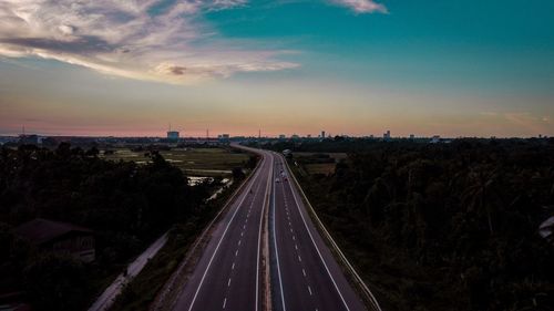 High angle view of railroad tracks at sunset