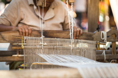 Midsection of manual worker working in textile industry