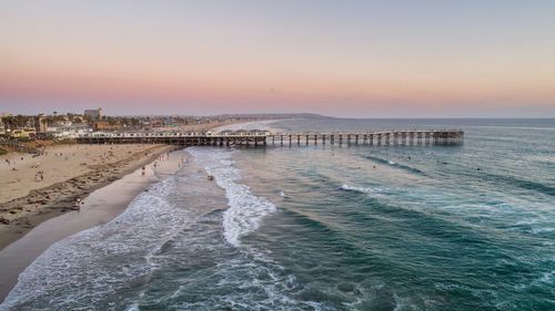 Scenic view of beach against sky during sunset