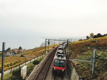 Train on railroad tracks against sky