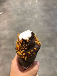 Person holding ice cream cone