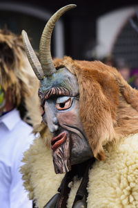 Public and traditional parade with funny masks at carnival