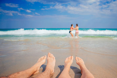 Low section of woman at beach