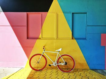 High angle view of bicycle parked against wall