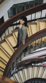 Woman on spiral staircase