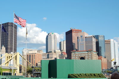 Low angle view of modern building against blue sky