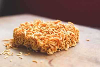 Close-up of raw noodles on table