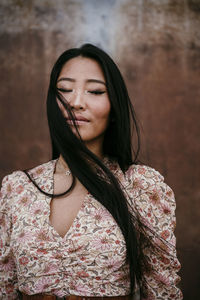 Close-up of woman looking at camera