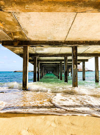 View of pier over sea against sky