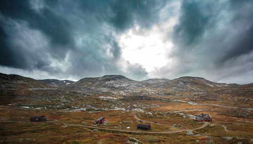Scenic view of mountains against cloudy sky