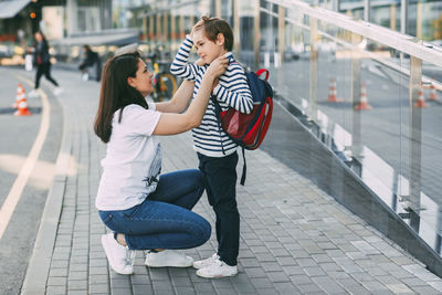 Close-up of mother and son on street