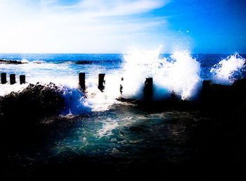 Scenic view of sea against blue sky